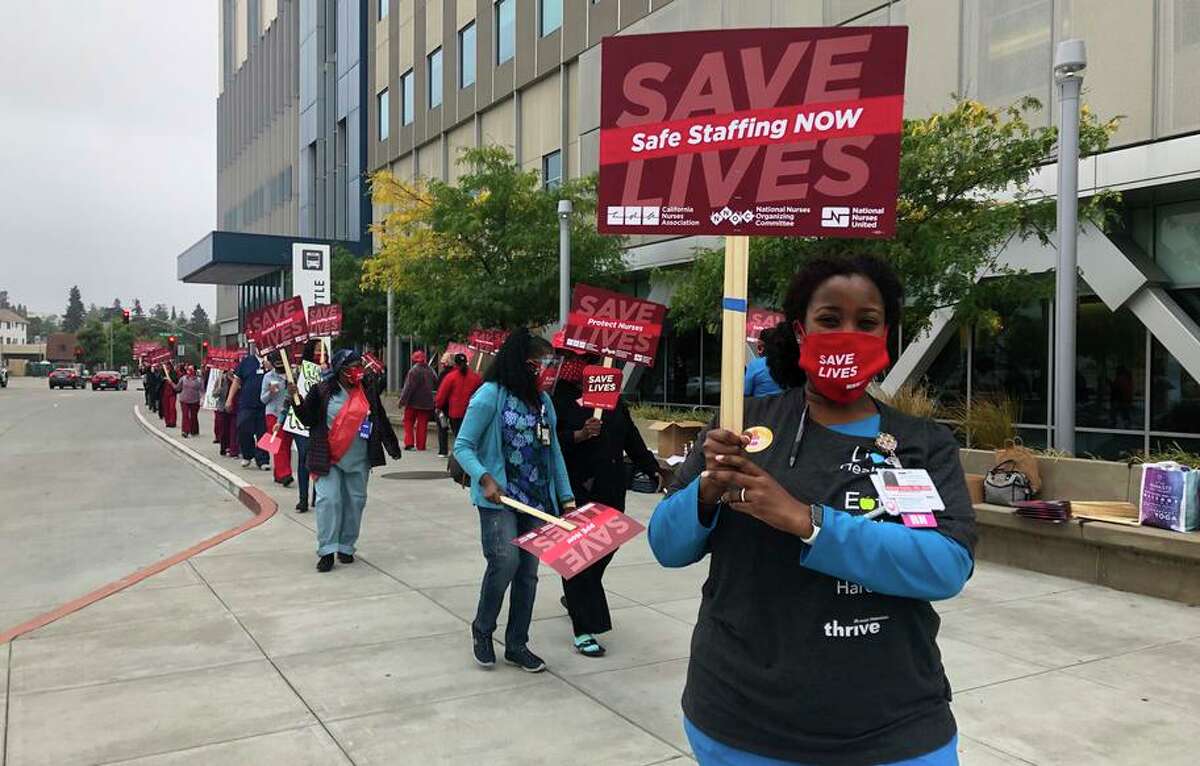 Emergency room nurse Stacey Eddie rallies for more staffing outside Kaiser Permanente’s Oakland hospital in August 2020.