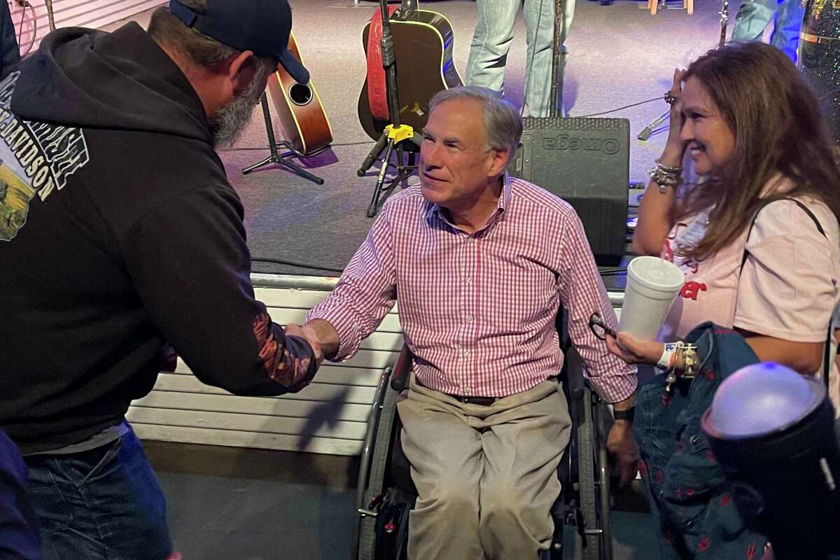 Greg Abbott shakes hands at an event in Corpus Christi earlier this month.