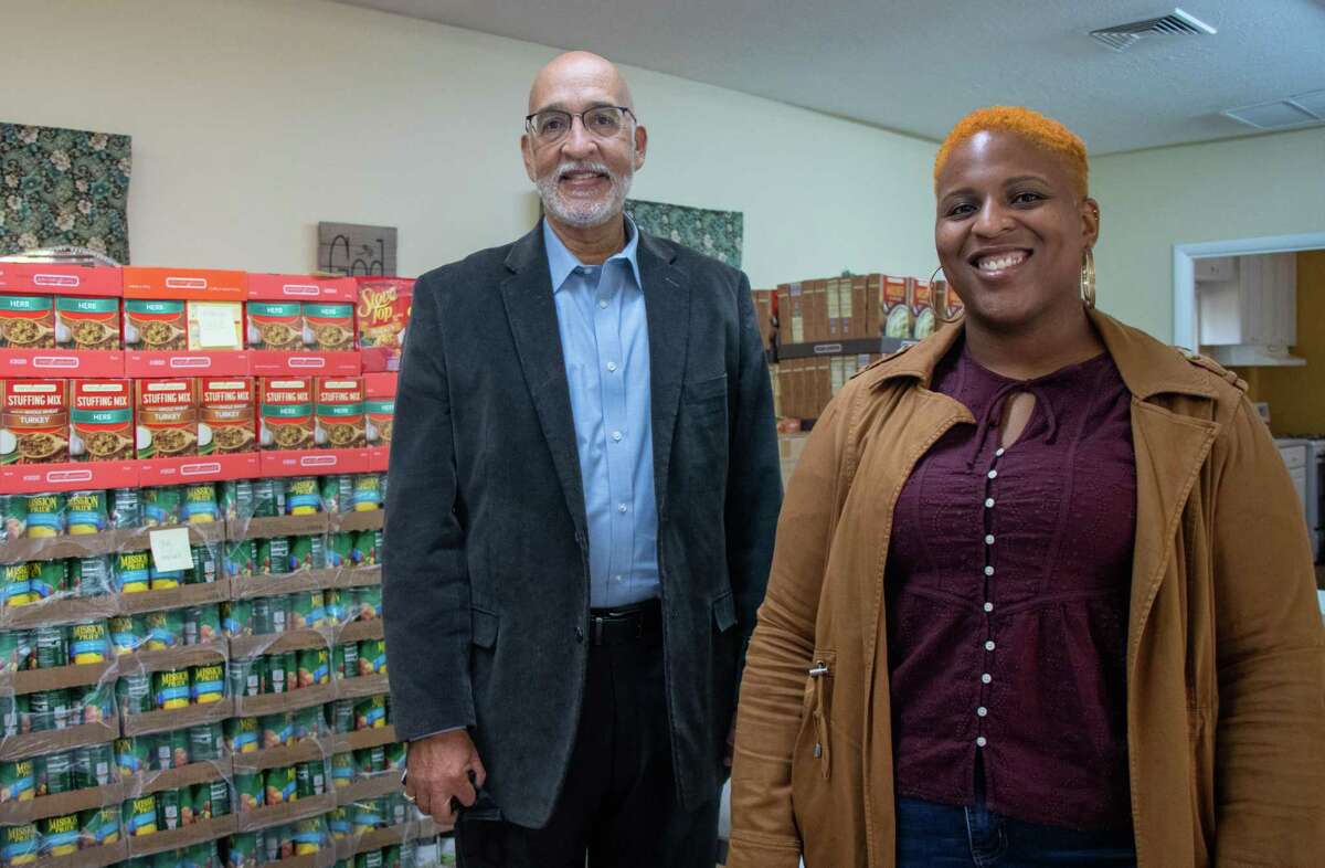 Rev.  Todd Foster (left), Storehouse Project executive director, and Kimani Sioux Williams, Storehouse Project operations manager, are getting ready to provide Thanksgiving baskets to families in Milford. Foster's goal is to giveaway 1,000 Thanksgiving Turkey baskets.