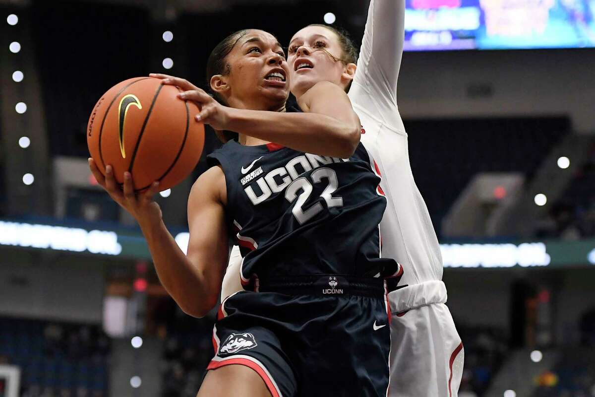 Connecticut's Evina Westbrook goes up to the basket as Arkansas' Sasha Goforth, right, defends in the first half of an NCAA college basketball game, Sunday, Nov. 14, 2021, in Hartford, Conn. (AP Photo/Jessica Hill)