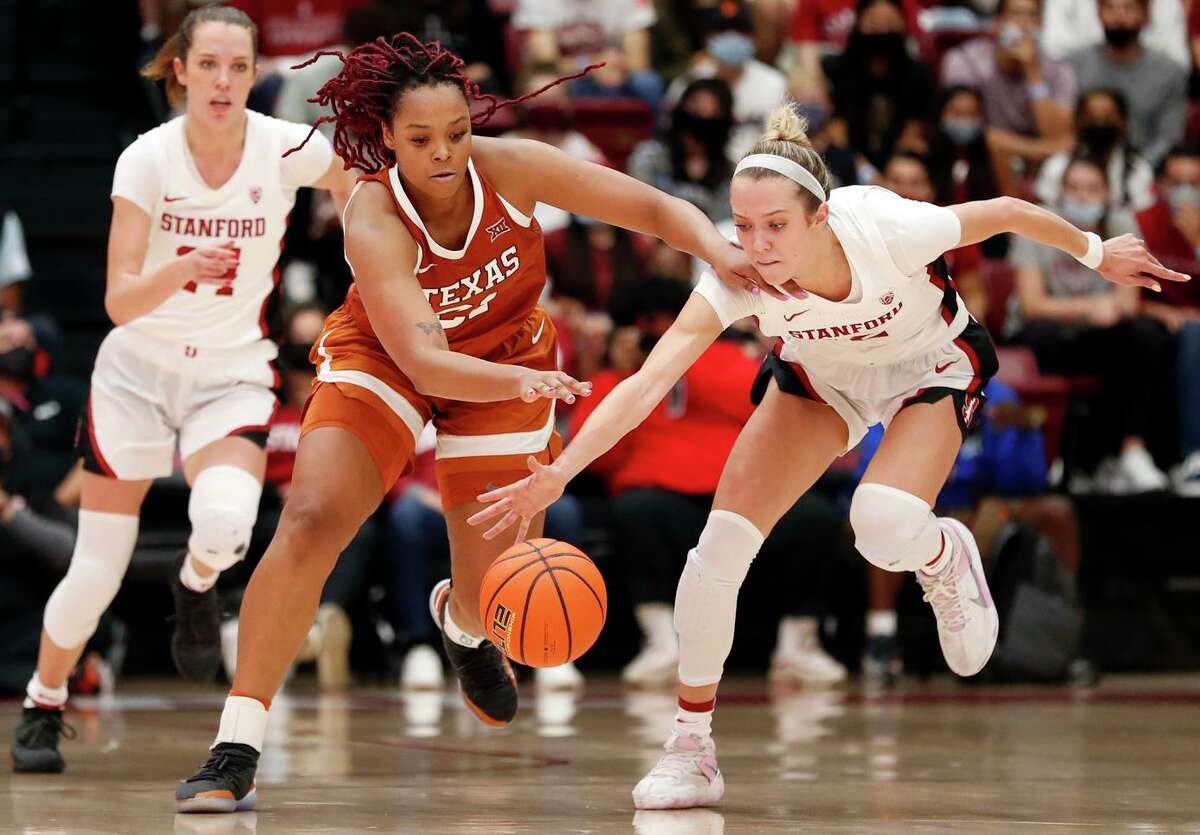 XXcombocutlineXXStanford's Lexie Hull and Texas' Aaliyah Moore vie for a loose ball in 4th quarter during Texas' 61-56 win in women's college basketball game at Maples Pavilion in Stanford, Calif., on Sunday, November 14, 2021.