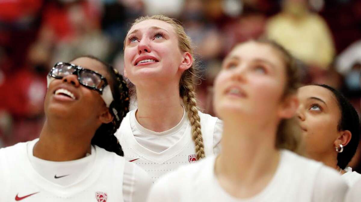 Stanford's Cameron Brink tears up as Kiana Williams gives a video message from Australia during National Championship ring ceremony following Texas' 61-56 win in women's college basketball game at Maples Pavilion in Stanford, Calif., on Sunday, November 14, 2021.