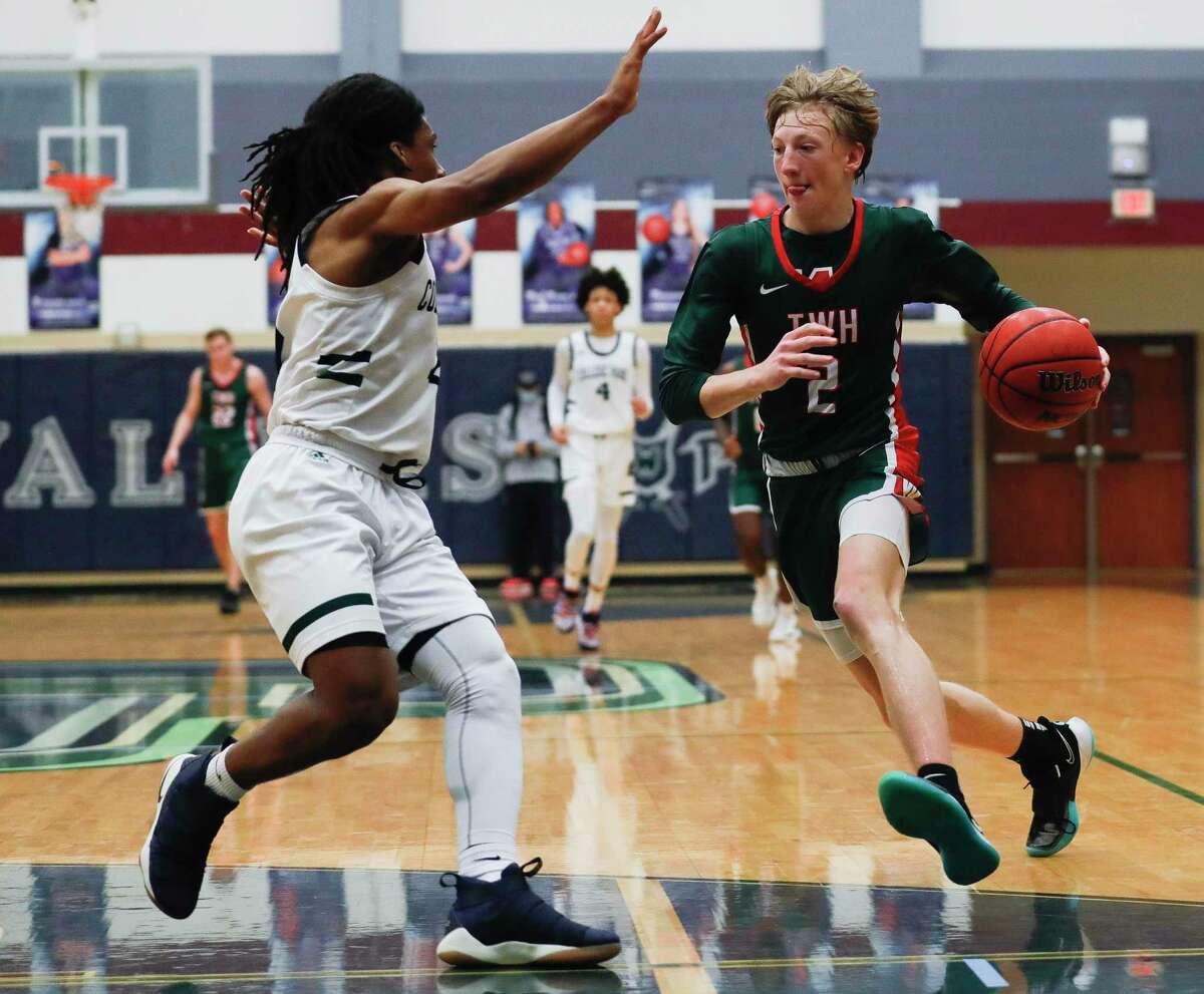 The Woodlands guard Shey Eberwein (2) drives the ball against College Park guard Marvin Dock (2) during the first quarter of a District 15-6A high school basketball game at College Park High School, Saturday, Jan. 23, 2021, in The Woodlands.
