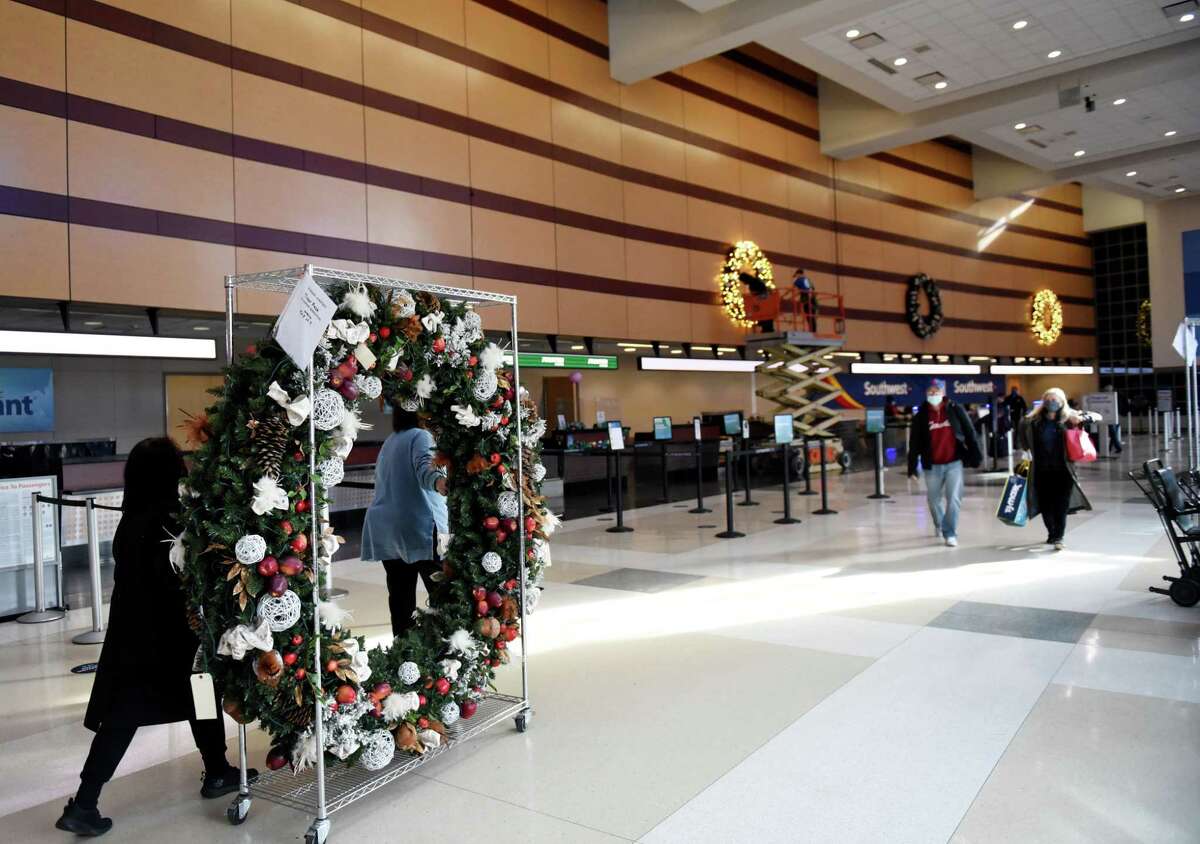 Holiday decorations are wheeled through the terminal at Albany International Airport on Monday, Nov. 15, 2021, in Colonie, N.Y. The county airport is expected to receive $28.7 million in federal funding through the infrastructure bill. Money would be used to modernize the terminal, expand the airport?•s cargo facility and construction of a new aircraft hangar.