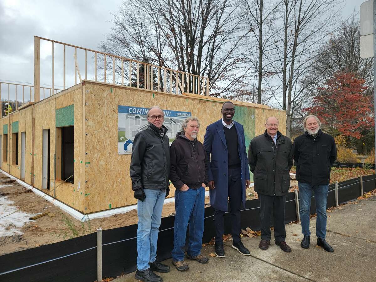 Lt. Gov. Garlin Gilchrist stopped by the construction site of apartments being built by Homestretch and talked with community leaders. (From left) John Harnish, president of Advocates for Benzie County; Bill Ward, president of the Village of Honor; Gilchrist; Johnathan Stimpson, executive director of Homestretch and Ingemar Johansson, president of the Honor Area Restoration Project.