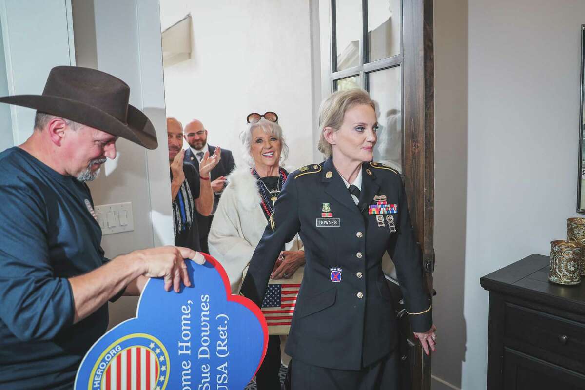Retired Cpl. Sue Downes was awarded a new home in Towne Lake thanks to Helping A Hero and Caldwell. The community welcomed her home with a celebration on Nov. 9, 2021.