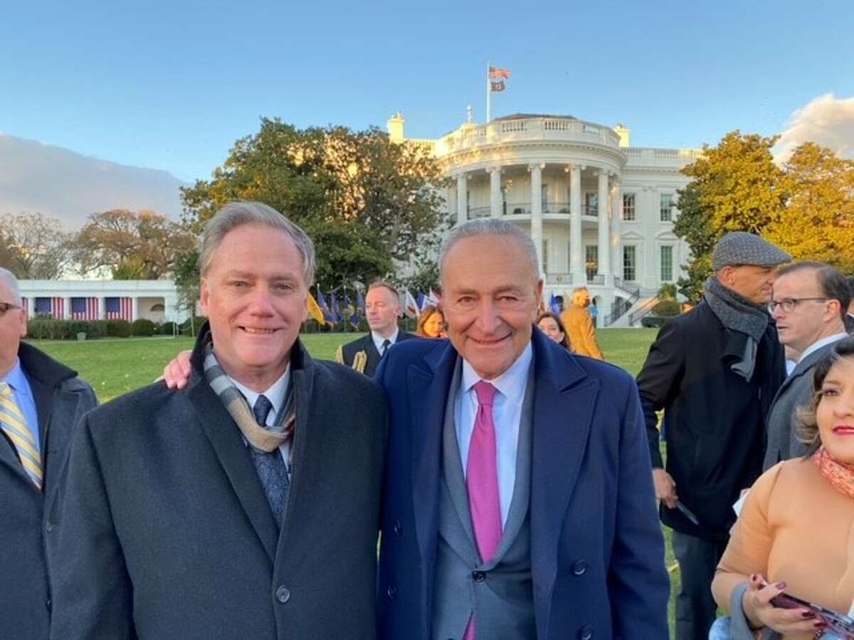 U.S. Sen. Charles E. Schumer, right, on the White House lawn Monday with Kevin Cushing, whose son Patrick was one of the 20 people killed in the October 2018 limousine crash in Schoharie. The Democratic majority leader invited Cushing to attend the signing ceremony for the $1 trillion federal infrastructure bill, which enacts and funds a series of reforms to improve limousine safety.