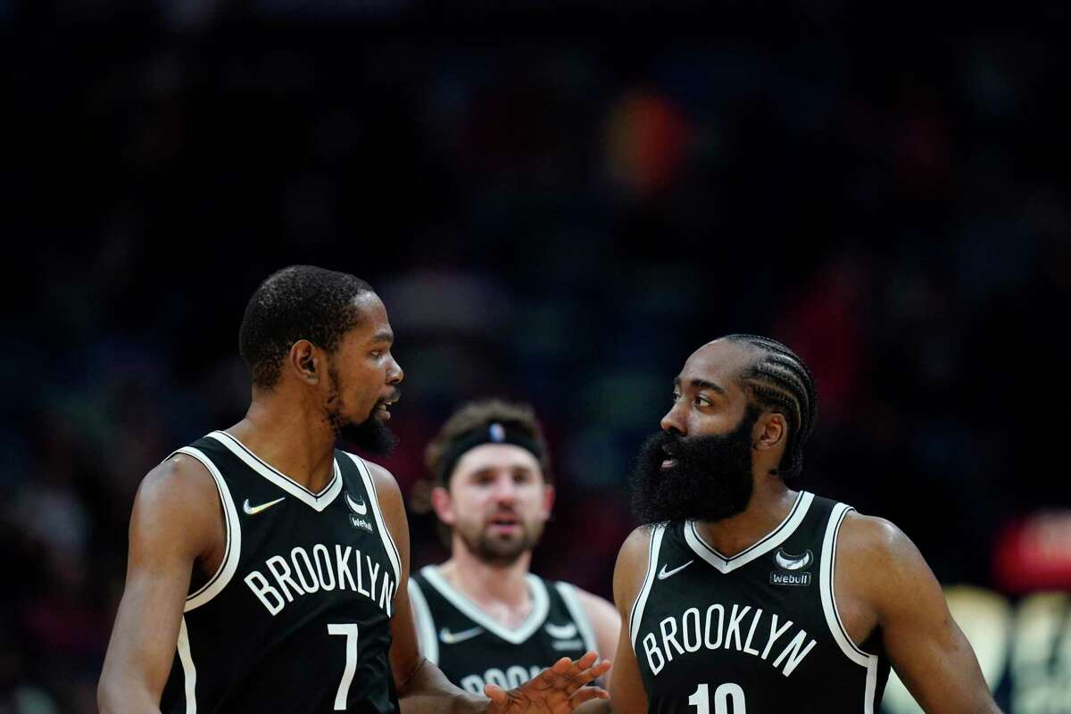 Kevin Durant (left), James Harden and the Nets take on the Warriors in Brooklyn at 4:30 p.m. Tuesday (TNT/95.7).