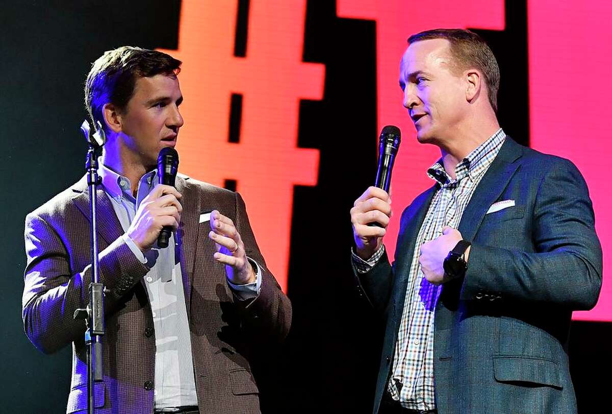 MIAMI, FLORIDA - JANUARY 30: Eli Manning (L) and Peyton Manning speak onstage during the EA Sports Bowl at Bud Light Super Bowl Music Fest on January 30, 2020 in Miami, Florida. (Photo by Frazer Harrison/Getty Images for EA Sports Bowl at Bud Light Super Bowl Music Fest )