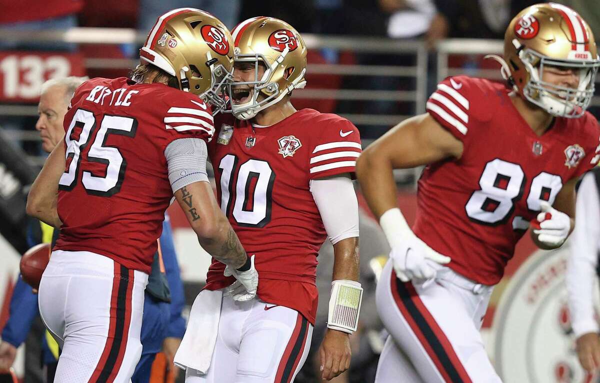 SANTA CLARA, CALIFORNIA - NOVEMBER 15: Jimmy Garoppolo #10 of the San Francisco 49ers congratulates George Kittle #85 after his touchdown in the first quarter against the Los Angeles Rams at Levi's Stadium on November 15, 2021 in Santa Clara, California. (Photo by Ezra Shaw/Getty Images)