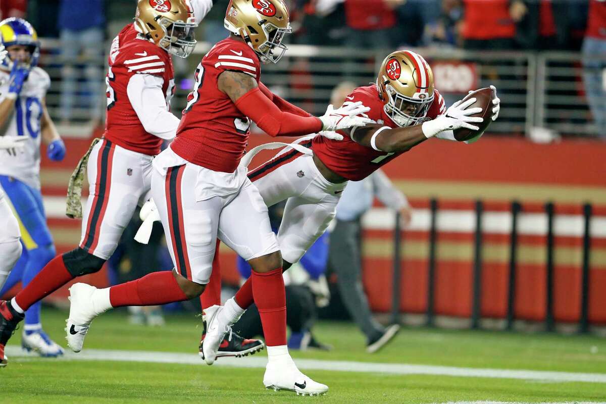 San Francisco 49ers' Jimmie Ward dives into the end zone for a pick six against Los Angeles Rams in 1st quarter during NFL game at Levi's Stadium in Santa Clara, Calif., on Monday, November 15, 2021.