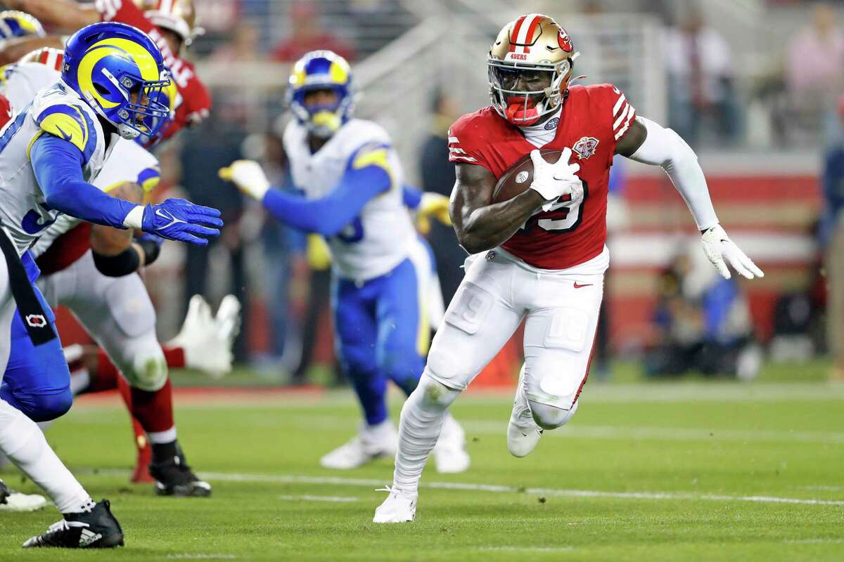 San Francisco 49ers' Deebo Samuel scores a touchdown on an 8-yard run in 2nd quarter against Los Angeles Rams during NFL game at Levi's Stadium in Santa Clara, Calif., on Monday, November 15, 2021.