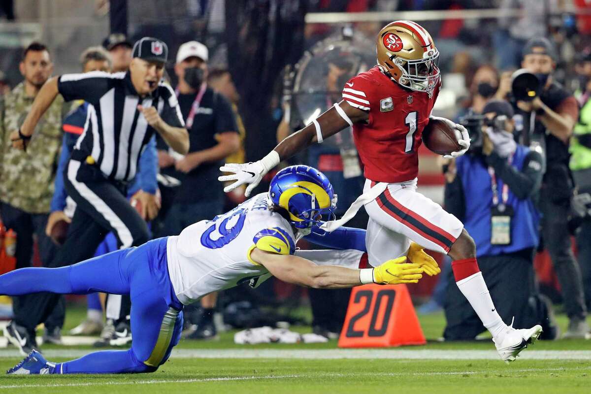San Francisco 49ers' Jimmie Ward outruns Los Angeles Rams' Tyler Higbee for a 1st quarter pick six during NFL game at Levi's Stadium in Santa Clara, Calif., on Monday, November 15, 2021.