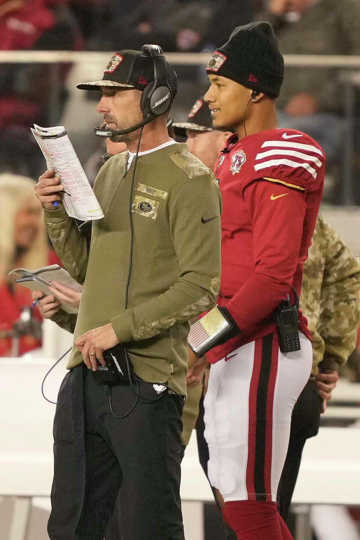 San Francisco 49ers head coach Kyle Shanahan, left, and quarterback Trey Lance watch from the sideline during the second half of an NFL football game against the Los Angeles Rams in Santa Clara, Calif., Monday, Nov. 15, 2021. (AP Photo/Tony Avelar)