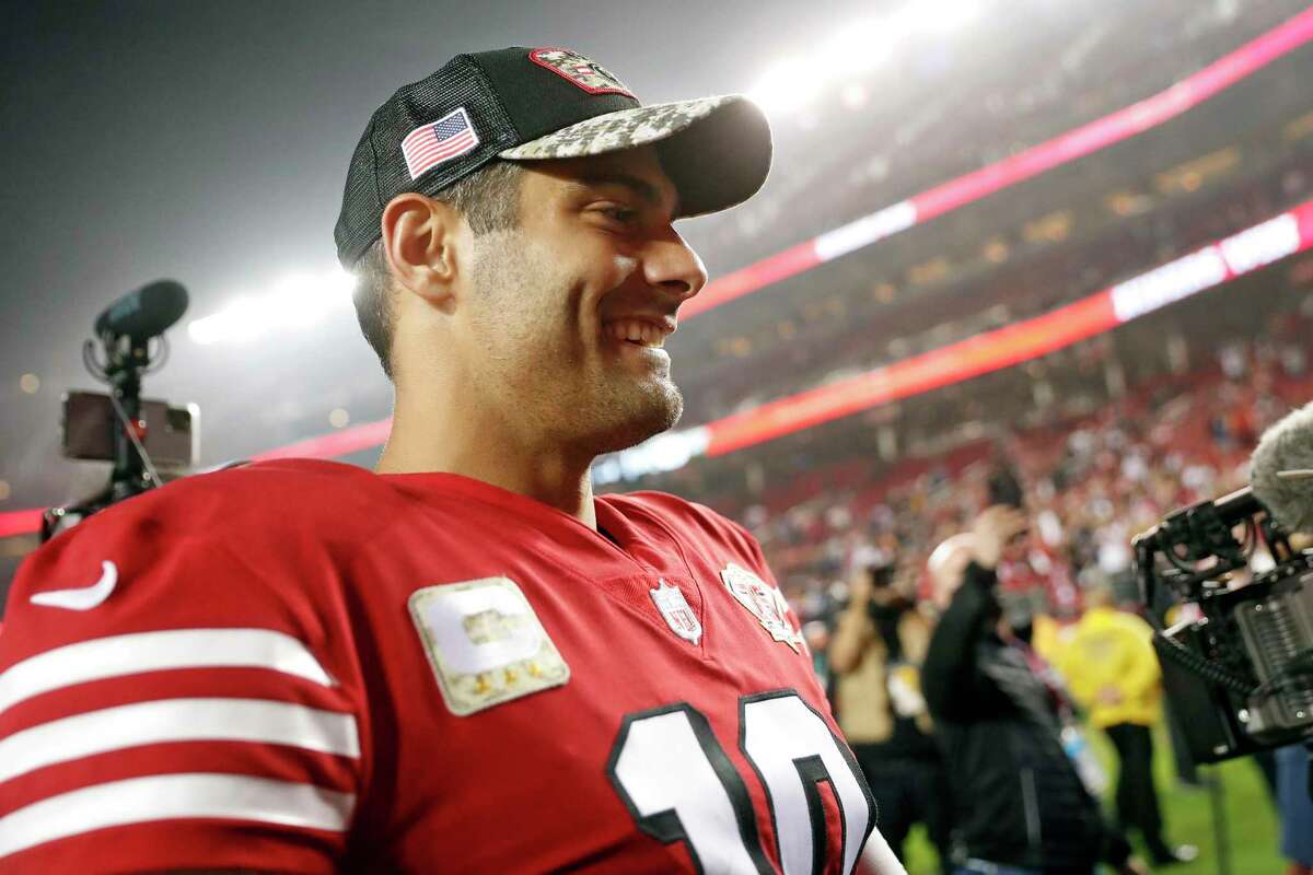 San Francisco 49ers' QB Jimmy Garoppolo smiles after Niners' 31-10 win over Los Angeles Rams on Nov. 15 at Levi's Stadium.