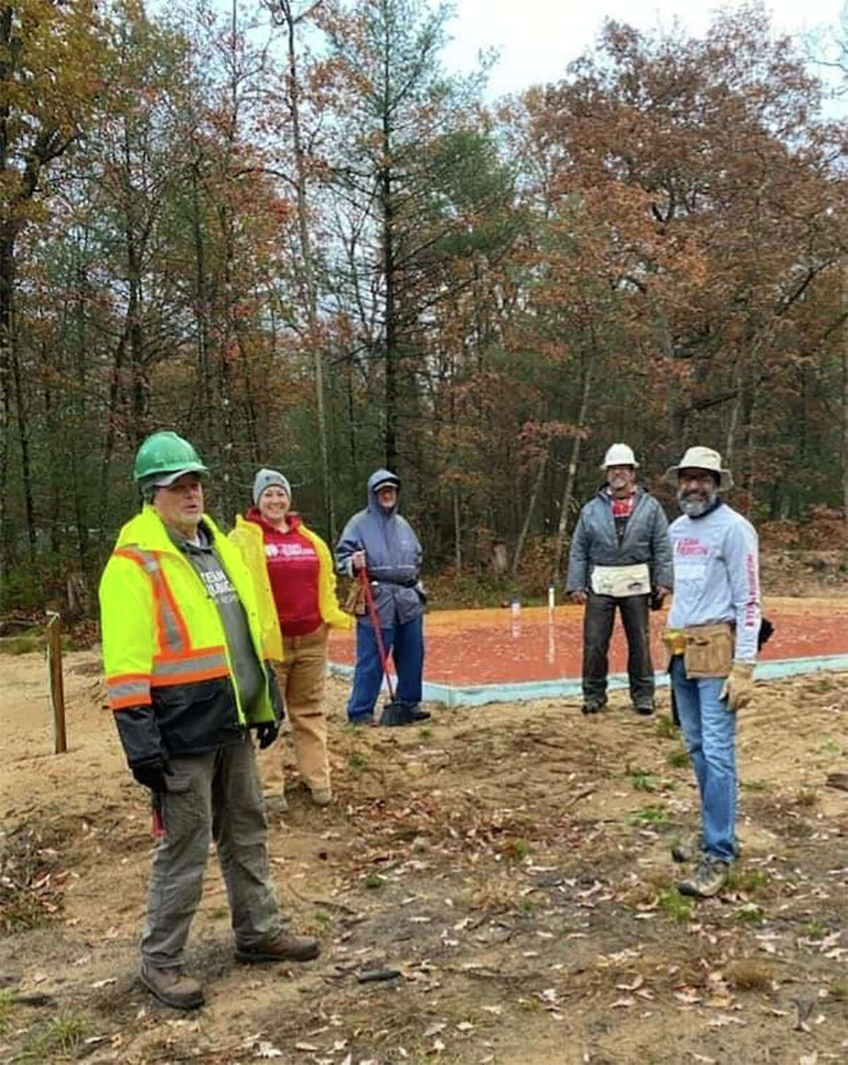 Military veterans from Team Rubicon, staff members from Habitat Michigan, and other volunteers gathered last weekend to raise the walls and trusses for a local veteran in Webber Township. 
