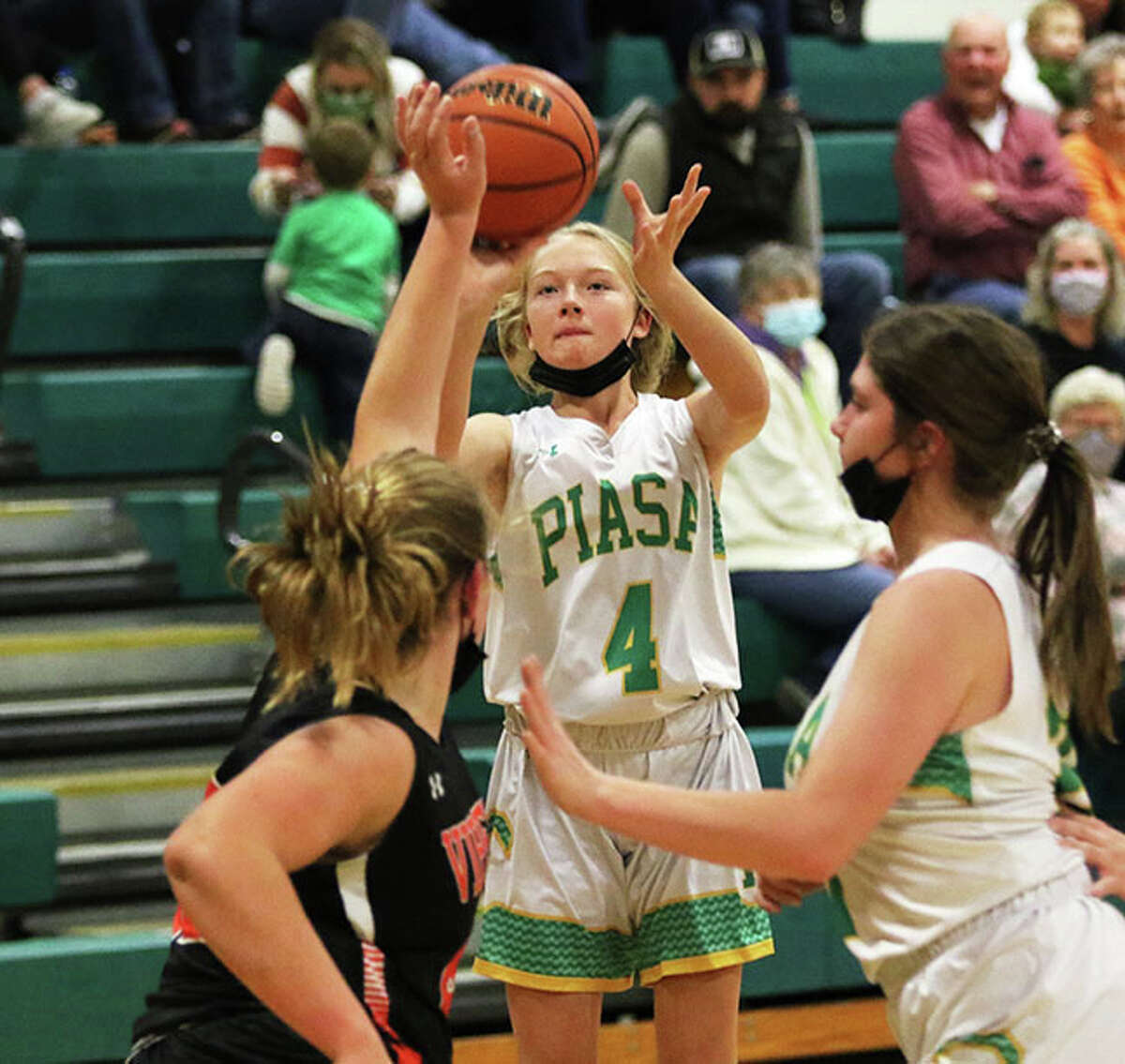 Southwestern freshman Gracie Darr (44) shoots over a South County defender Monday night in Piasa.