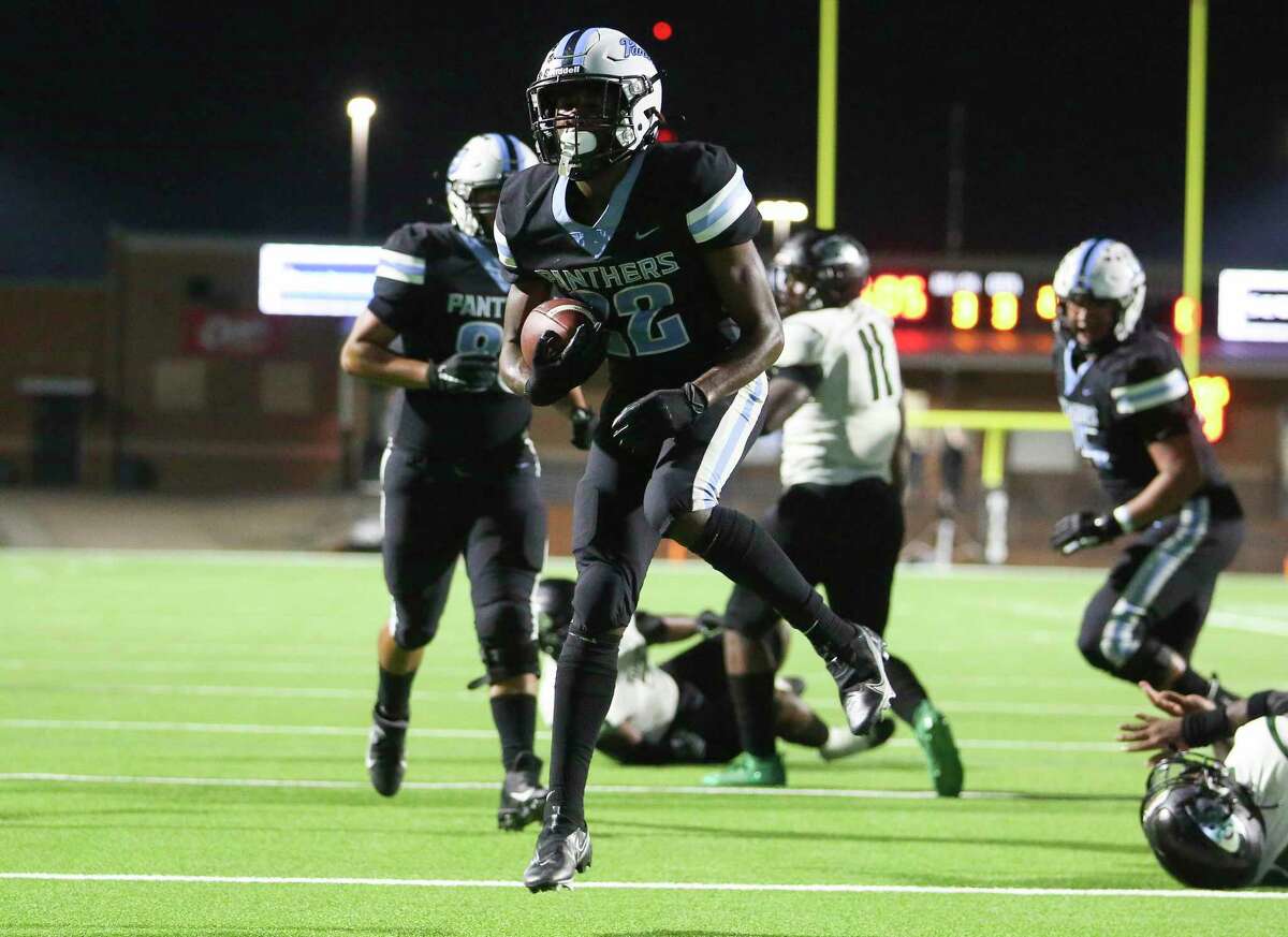 Paetow running back Damyrion Phillips (22) scores a touchdown against Hightower during the bottom half of District 10-5A Division I high school football game Thursday, Oct. 21, 2021, in Katy. Paetow Panthers defeated Hightower Hurricanes 55-7.