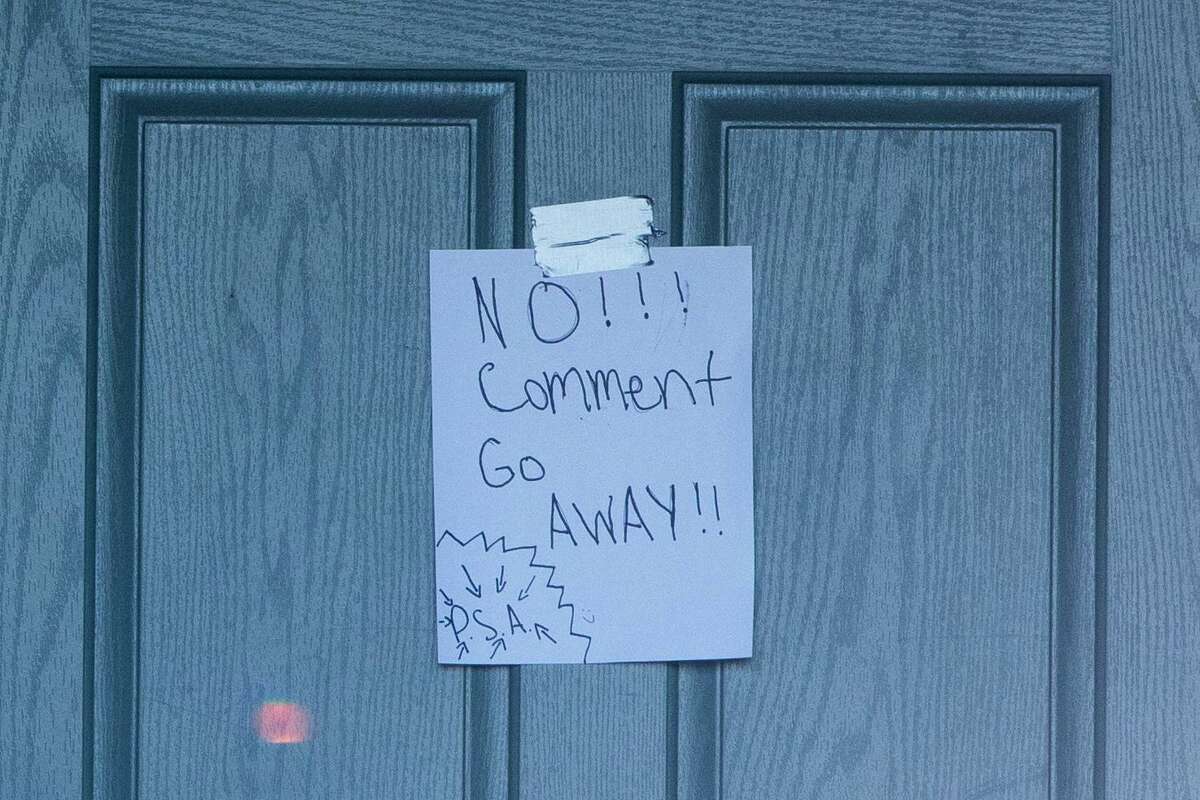 A sign reading “No!!! Comment Go Away!!” is posted on the door of the home of former Windsor mayor Dominic Foppoli following an early morning police raid of the premises in Windsor last Wednesday as part of an ongoing investigation into sexual assault allegations.