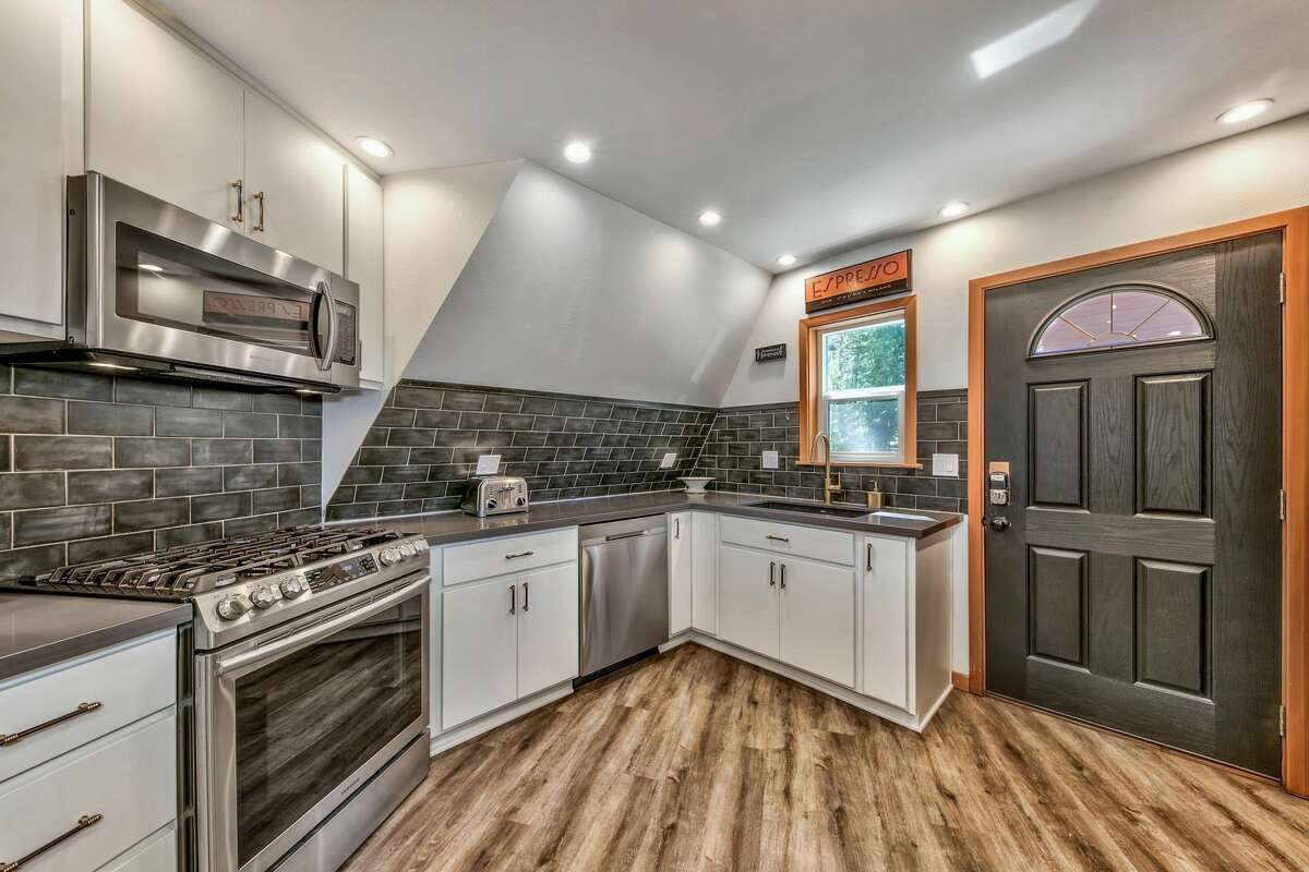 The kitchen has its own access to a porch outside.