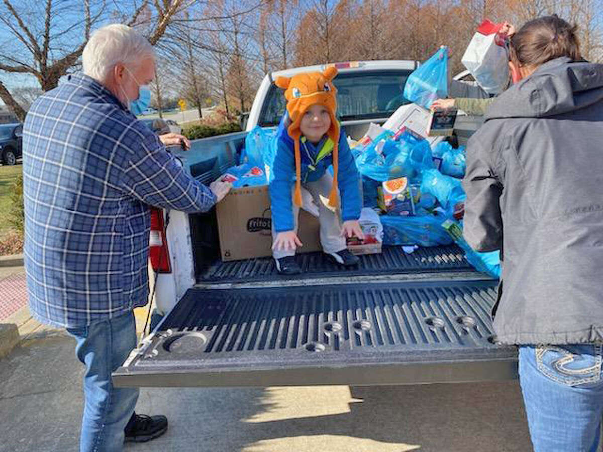 Volunteers at Glen-Ed Pantry unload food items during last year’s Scouting for Food drive.