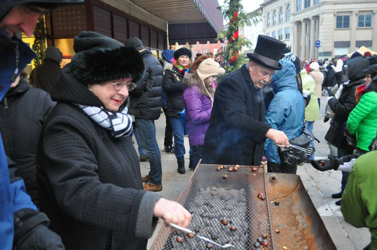 Bob and Jan Kenny serve up some chestnuts during theVictorian Sleighbell Parade. The 2021 event will take place on Dec. 4.