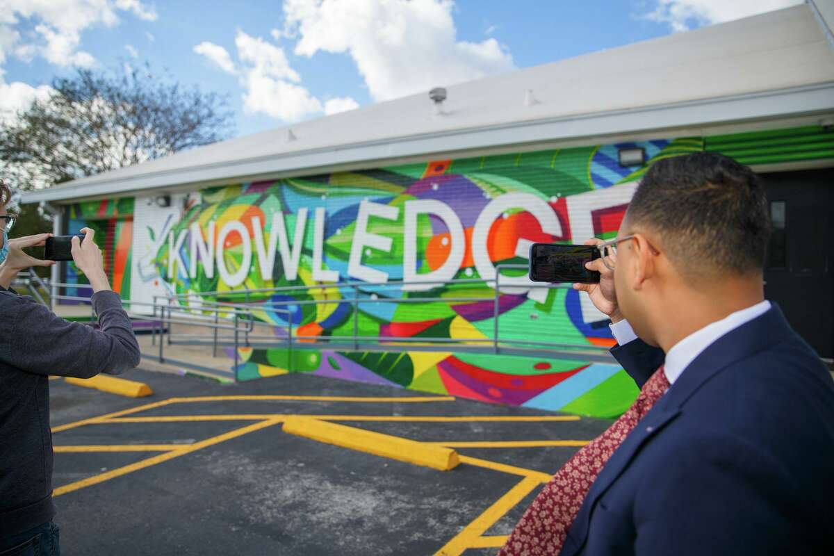 The new augmented reality feature of the Aldine Branch Library's mural "Spreading Knowledge" by Houston artist DUAL can be accessed by scanning a QR code with a smartphone.