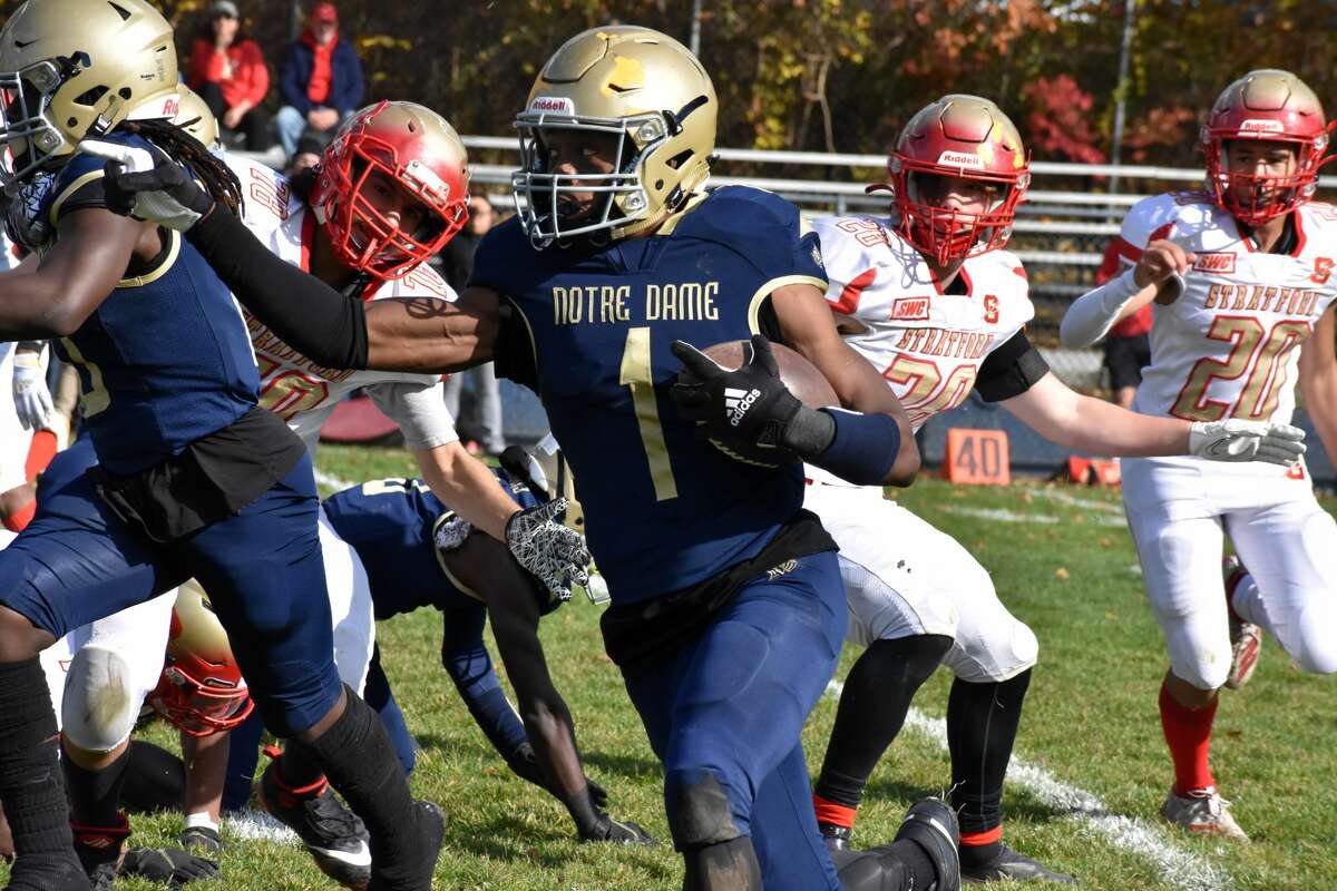Notre Dame-Fairfield's Tayshawn Dixon runs with the ball during a football game between Notre Dame-Fairfield and Stratford at McCarty Stadium, Fairfield on Saturday, Nov. 13, 2021.