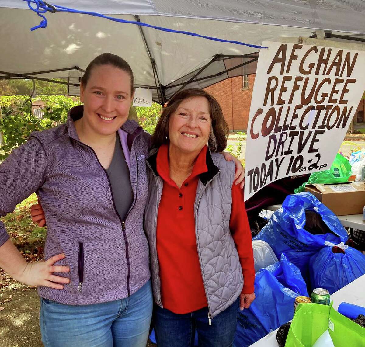 Judy Keane, right, along with her daughter, Chrissy Keane Doughty, at the Madison drive to collect household items for refugees being resettled in Connecticut through IRIS.