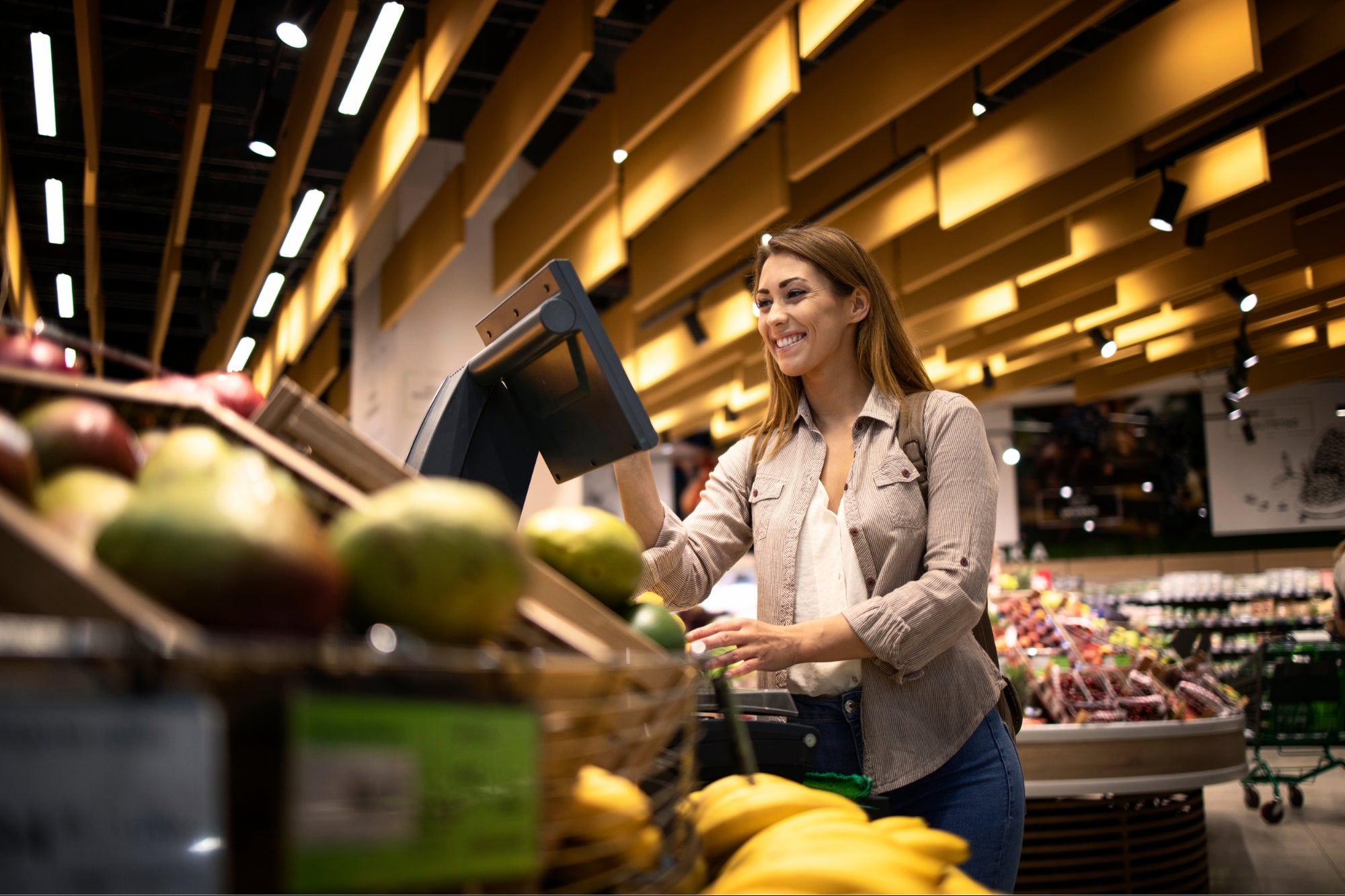 Woman is at the supermarket standing. Grocery Store Angry.