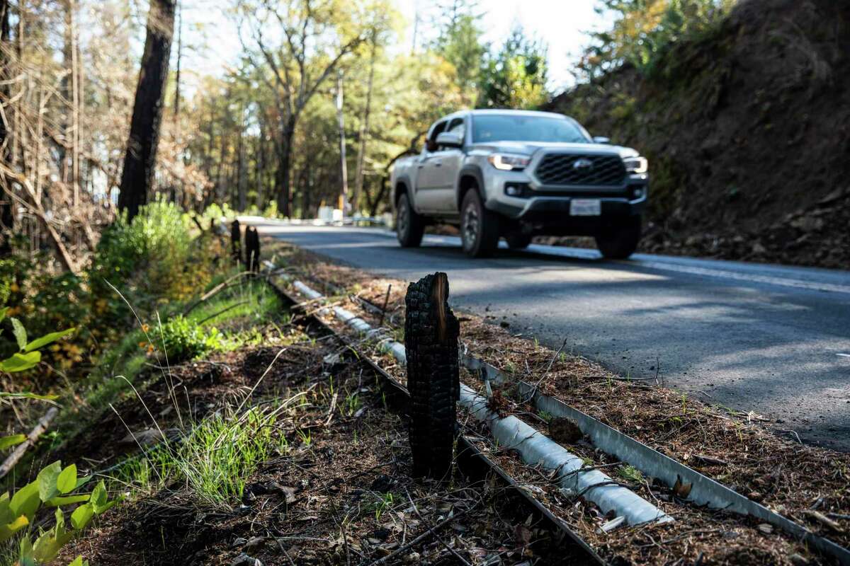 A fallen guardrail with burn damage near the origin of an alleged backfire set along Spring Mountain Road during the 2020 Glass Fire in St. Helena.