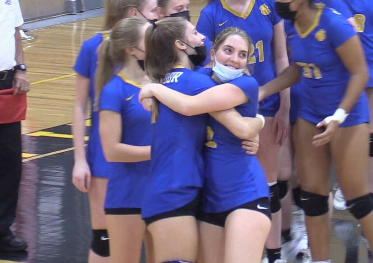 Seymour’s Kenzie Sirowich, left, and Emma Rousseau celebrate their 3-0 win over Mercy in the CIAC Class M volleyball semifinals on Tuesday, November 16, 2021 at Jonathan Law High School in Milford, Conn.