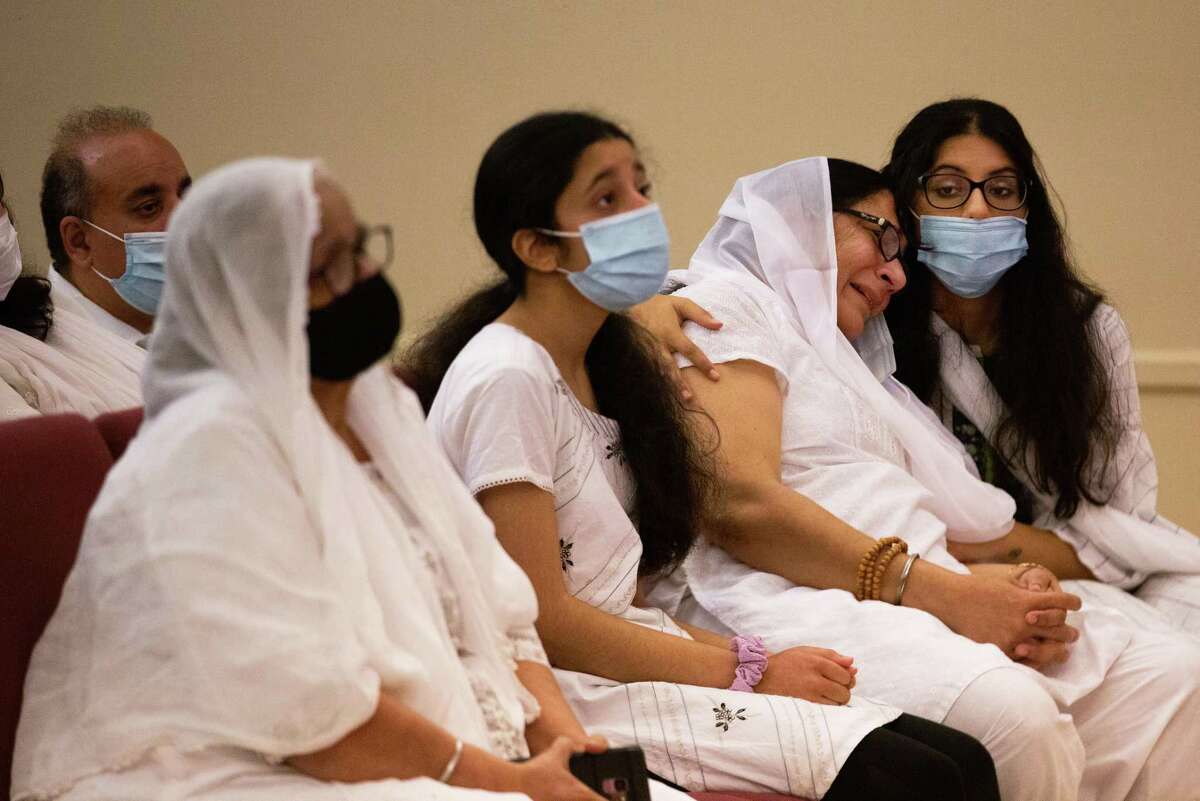 Family of Astroworld Festival victim Bharti Shahani, 22, mourns at her funeral at the Winford Funeral Home before a service, Tuesday, Nov. 16, 2021, in Houston. The Texas A&M student was critically injured during a crowd surge while Travis Scott performed at the festival. She eventually died.