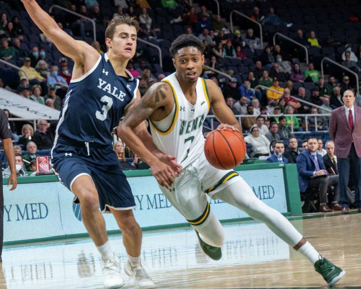 Siena College junior Colby Rogers makes a move in front of Yale University sophomore August Mahoney during a game at the Times Union Center on Tuesday, Nov. 16, 2021 (Jim Franco/Special to the Times Union)