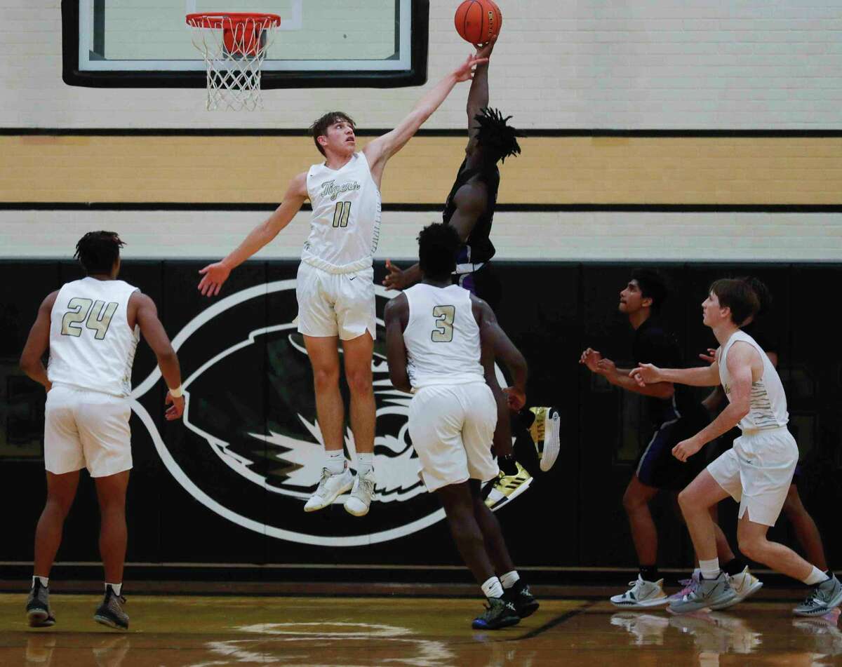 Conroe forward Nick Gergley (11) blocks a shot during the first quarter of a non-district high school basketball game at Conroe High School, Tuesday, Oct. 16, 2021, in Conroe.