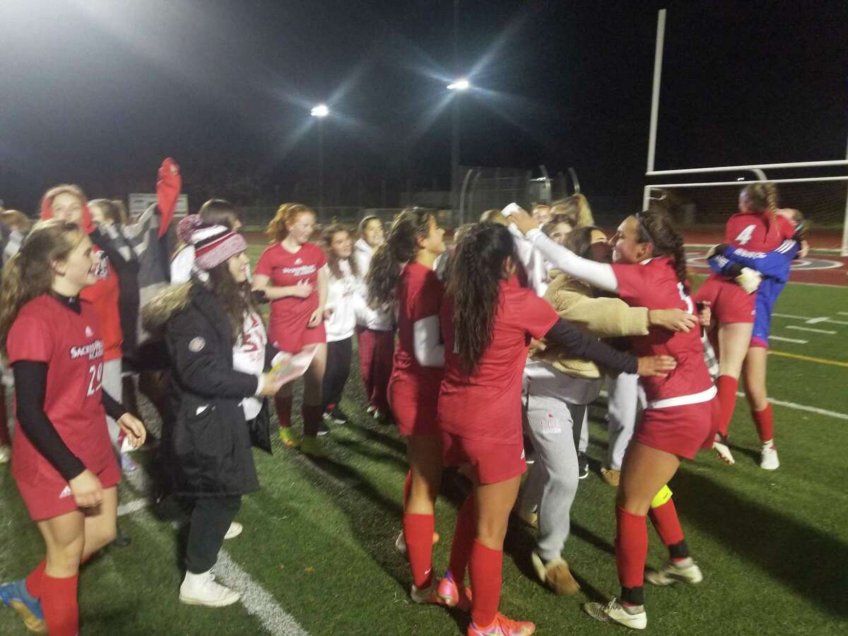 The Sacred Heart Academy girls soccer team celebrates its 1-0 victory over Notre Dame-Fairfield at Naugatuck High on Tuesday.