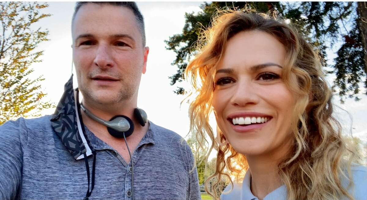Madison, Conn. native Matthew Brady served as the executive producer on the Hallmark Christmas movie, "An Unexpected Christmas." Brady (left) posed for a photo with one of the film's stars, Bethany Joy Lenz (right), who previously played Haley James Scott on "One Tree Hill."