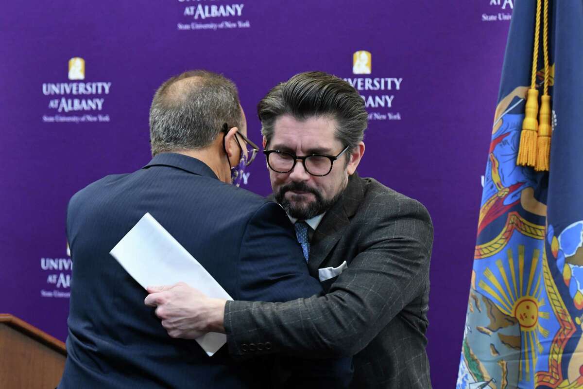 University at Albany President Havid‡n Rodr’guez, left, embraces SUNY Chancellor Jim Malatras, during an announcement for the opening of the university?•s new ETEC center, a state-of-the-art research and development complex, on Wednesday, Nov. 17, 2021, on the Harriman State Office Complex in Albany, N.Y. The $180 million facility is a hub for climate science, emergency preparedness and cybersecurity.
