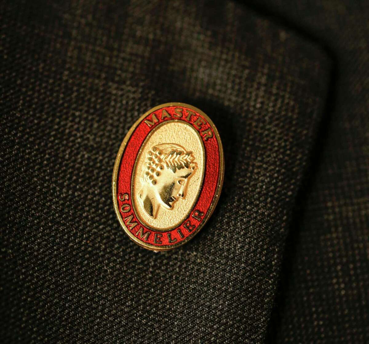 The marker of a master sommelier is the coveted pin that they wear.