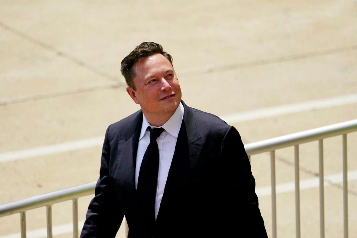 FILE - CEO Elon Musk departs from the justice center in Wilmington, Del., Tuesday, July 13, 2021. Musk is selling more Tesla shares than he needs to pay current tax obligations, and experts say he's either converting part of his fortune from stock to cash, or he's saving for bigger tax bills that will come due next year. As of early Wednesday, Nov. 17, Musk had sold roughly 8.2 million shares in the electric car and solar panel maker in the past nine days, worth a total of just over $8.8 billion.