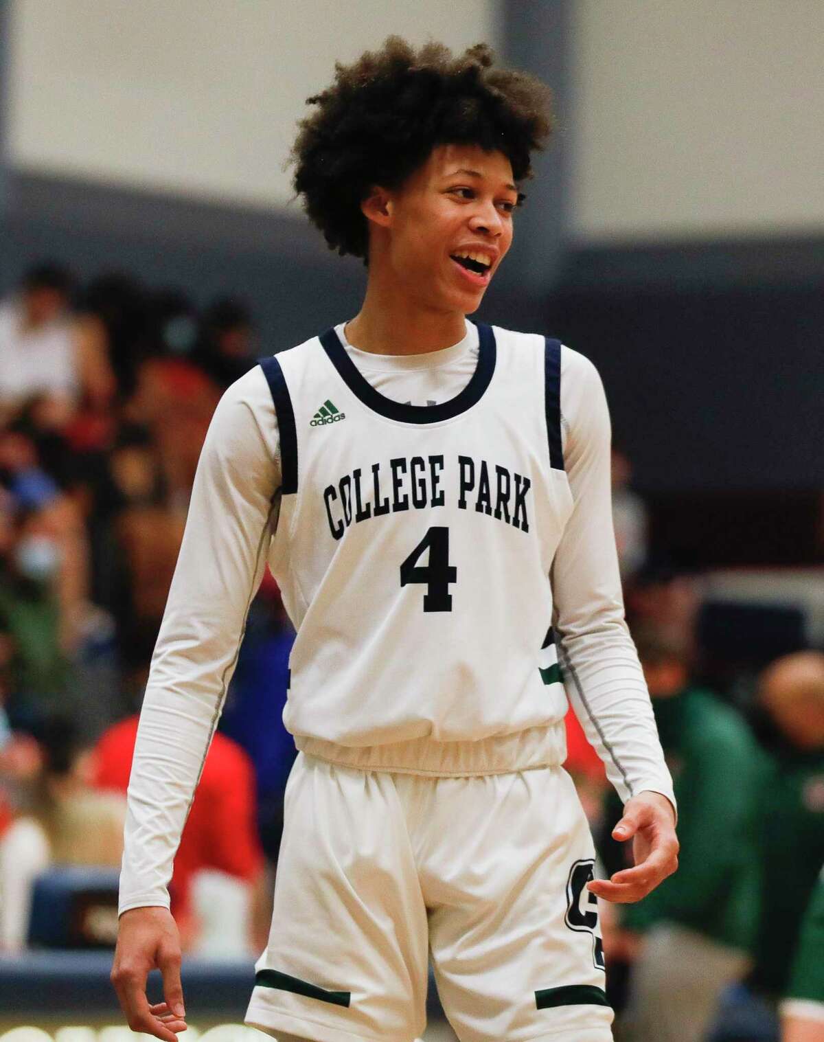 College Park guard Darel Reece (4) jokes with teammates during the second quarter of a District 15-6A high school basketball game at College Park High School, Saturday, Jan. 23, 2021, in The Woodlands.