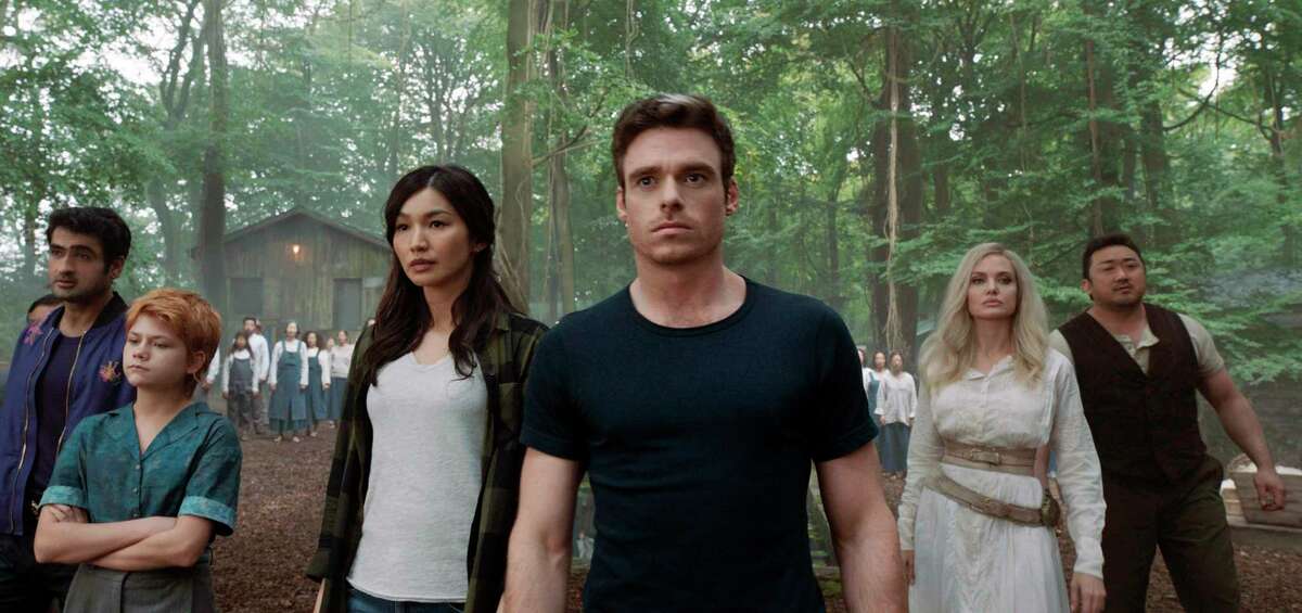 This image released by Marvel Studios shows,, from left, Kumail Nanjiani, Lia McHugh, Gemma Chan, Richard Madden, Angelina Jolie and Don Lee in a scene from "Eternals."
