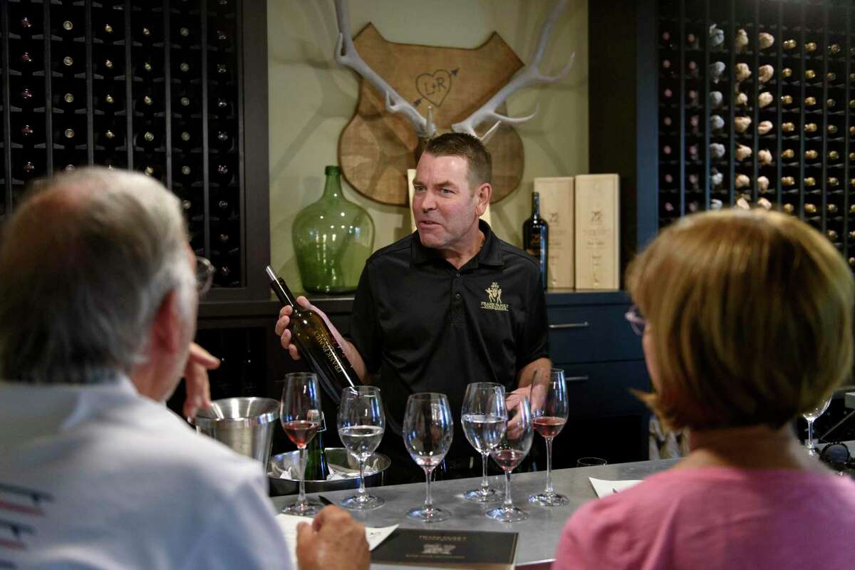 Host Monty Hayward talks to visitors to the Frank Family tasting room in Calistoga in 2018.