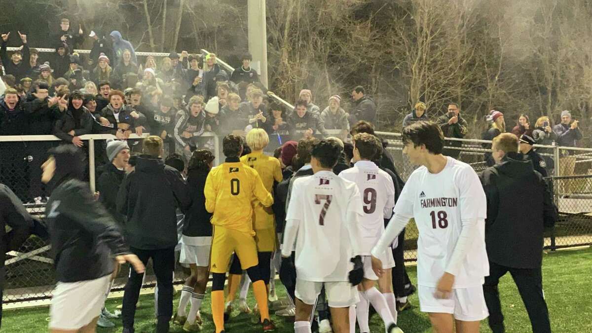 Seventh-seeded Farmington celebrates its 1-0 win over sixth-seeded Staples Wednesday in the CIAC Class LL semifinals at Municipal Stadium in Waterbury.