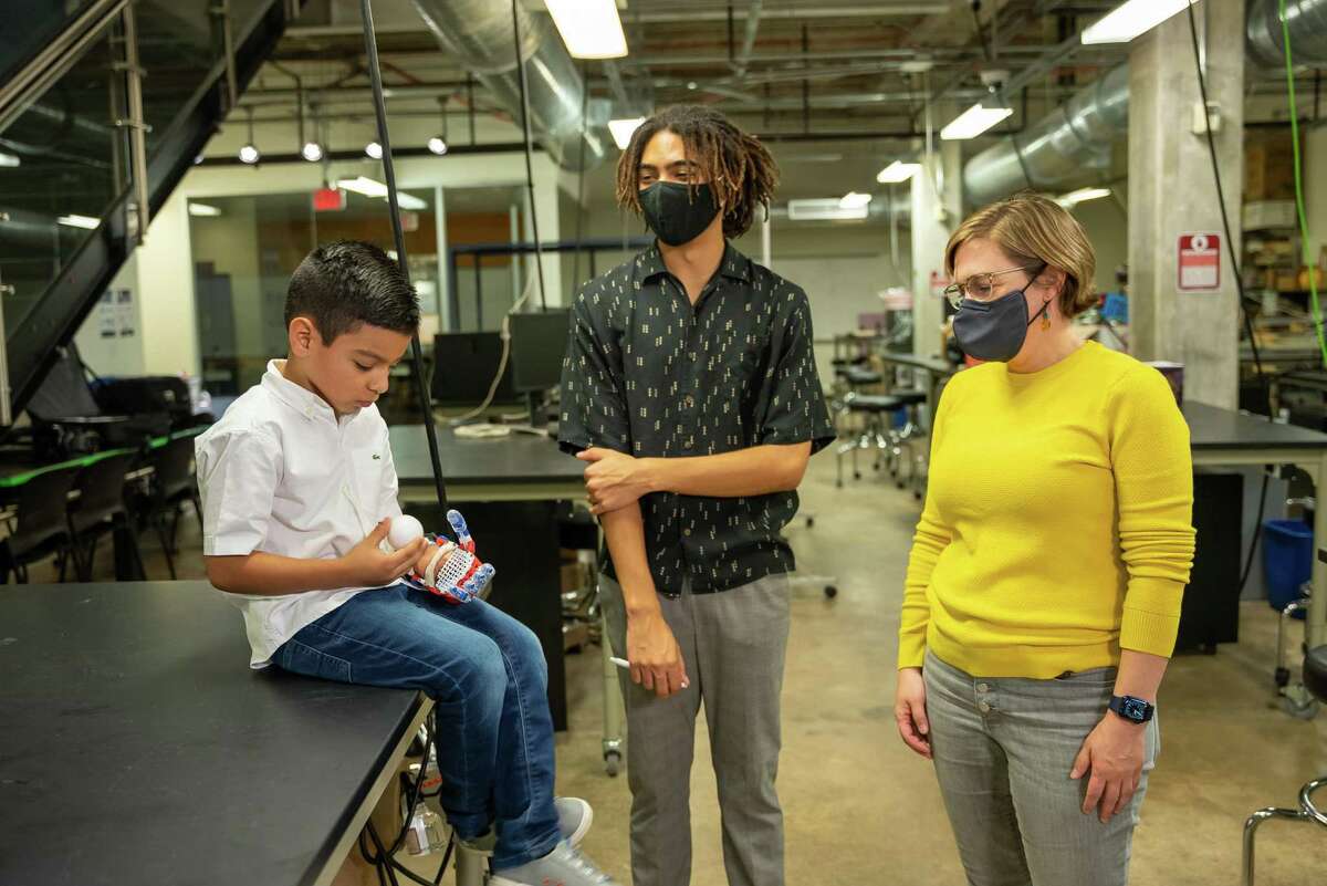 Rice University student club builds prosthetic for Texas Children’s Hospital patient. From left, Adriel Rivas, Arinze Appio-Riley, and Dr. Deirdre Hunter.