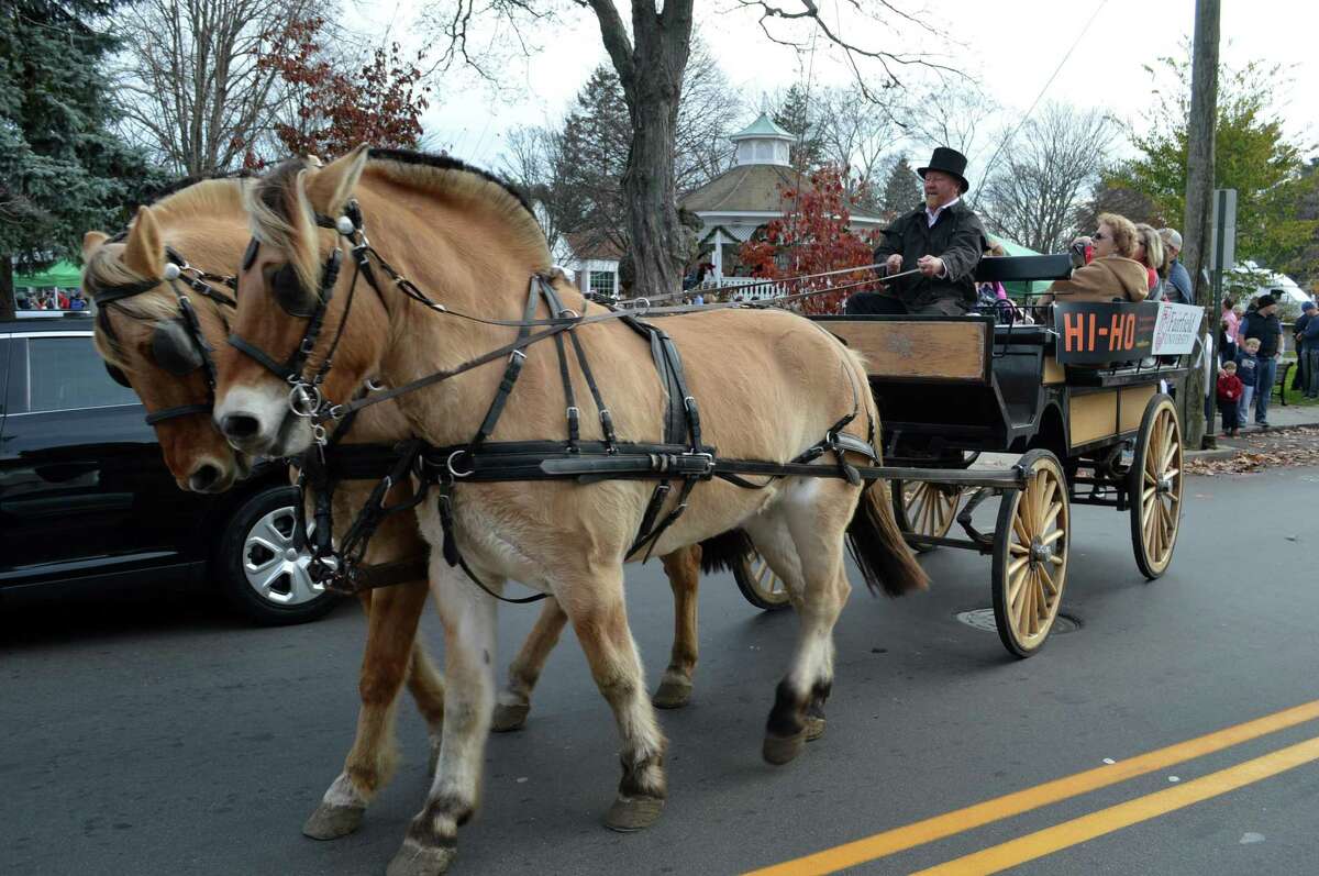 Brothers Billy, and Bob are are a two-horse team pulling the wagon rides for previous visitors to the Fairfield Chamber of Commerce's festivities to welcome Santa Claus in downtown Fairfield in a recent year. Santa Claus is returning to Fairfield at 10 a.m. where he will be until 2 p.m., all on Artists Sunday, Sunday, Nov. 28, after two years of not doing so because of the coronavirus pandemic.