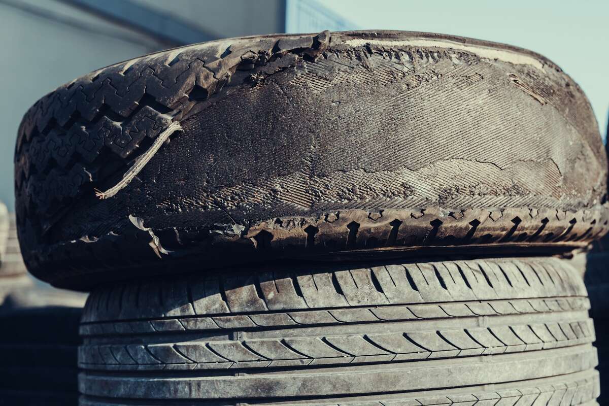 Close-up of damaged tires. A bunch of old tires from used cars. 