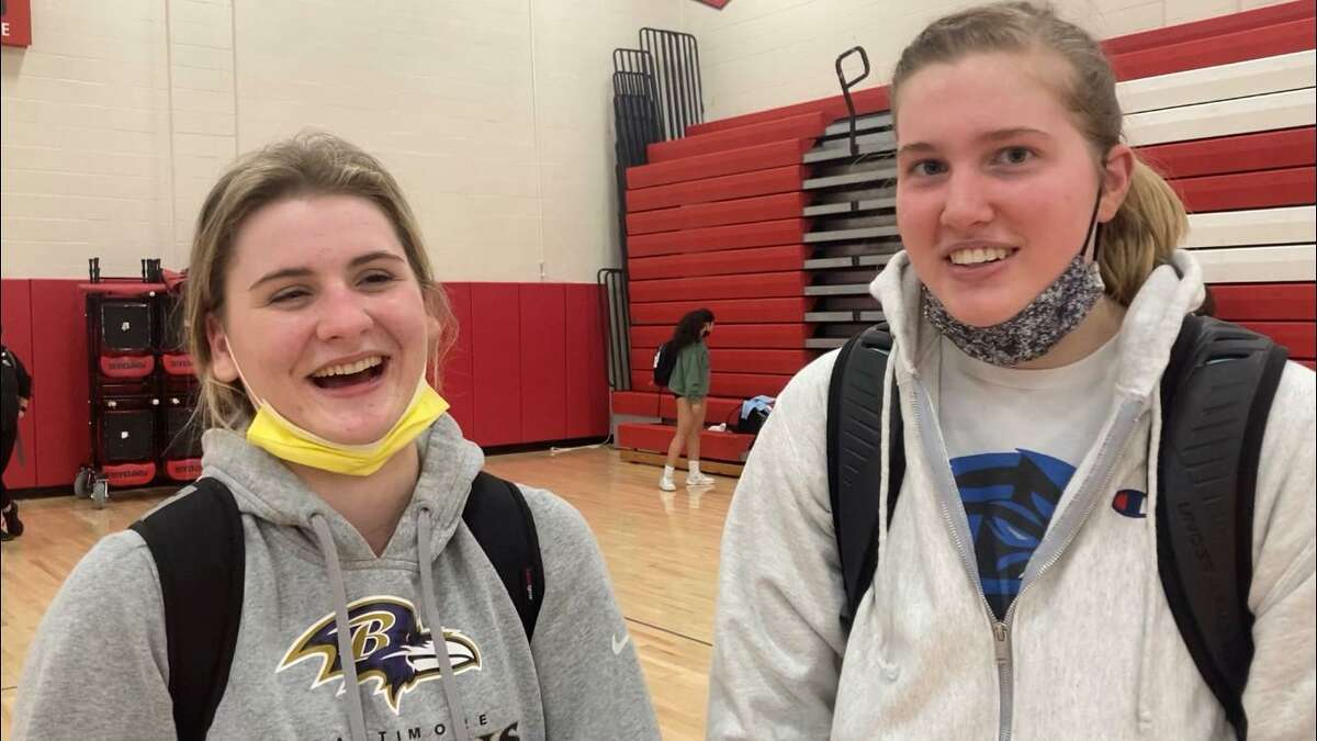 Ludlowe’s Phoebe Koskinas left, Jane Ransome right after the Falcons’ 3-1 win over Cheshire in the CIAC Class LL volleyball semifinals on Wednesday, November 17, 2021 at Pomperaug High School in Southbury, Conn.