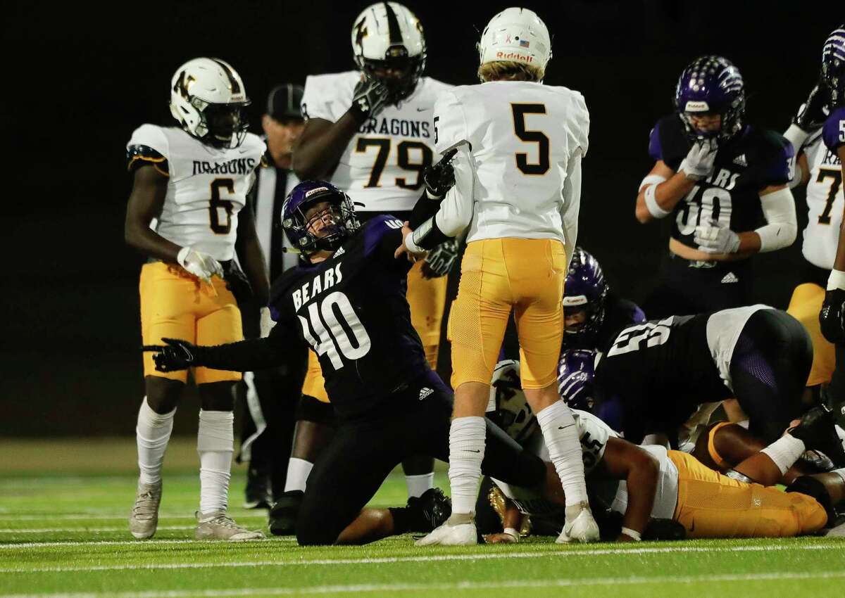 Montgomery linebacker Leslie Williams (40) reacts after the defense forced a turnvoer during the third quarter of a Region III-5A (Div. II) bi-district high school playoff game at MISD Stadium, Friday, Nov. 12, 2021, in Montgomery.