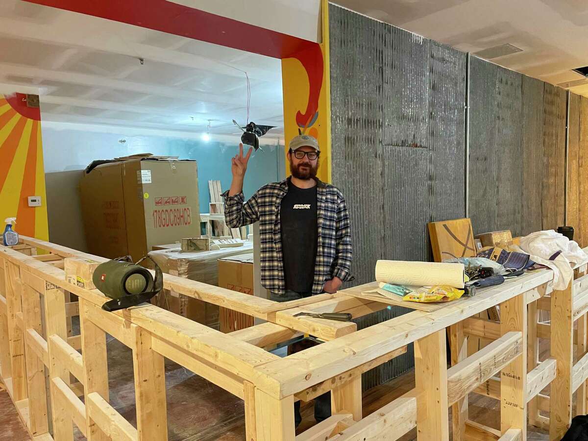 Pint Sized owner August Rosa is seen preparing the space in November for its Dec. 10, 2021, opening.